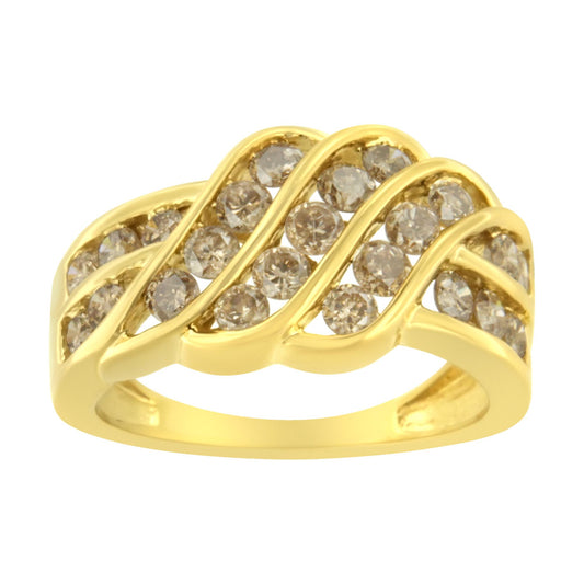 Yellow metal ring with three wavy rows of round brownish gemstones in a channel setting, shown at a slight angle.