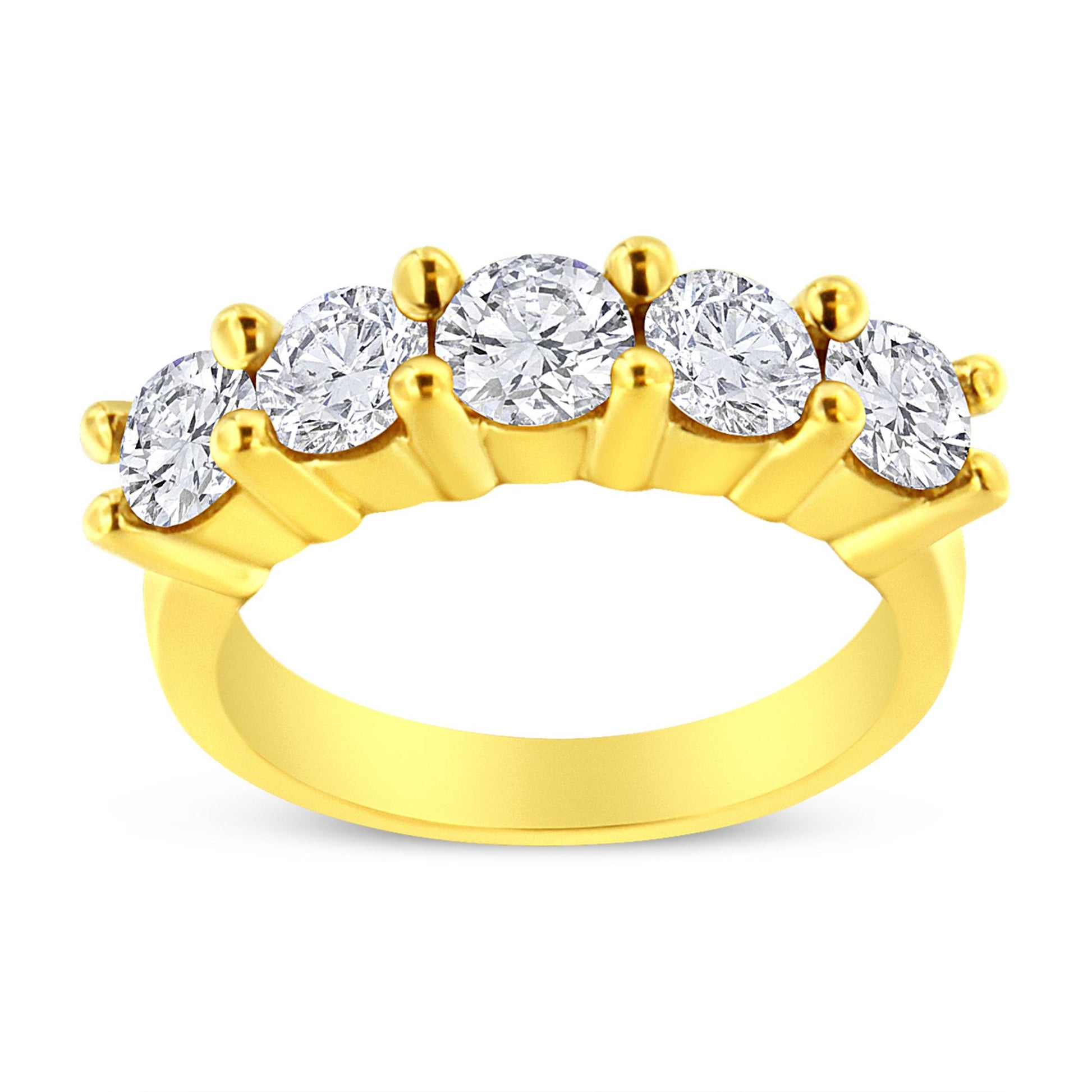 Front angled view of a yellow metal ring featuring five round white gemstones set in prongs.