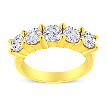 Front angled view of a yellow metal ring featuring five round white gemstones set in prongs.