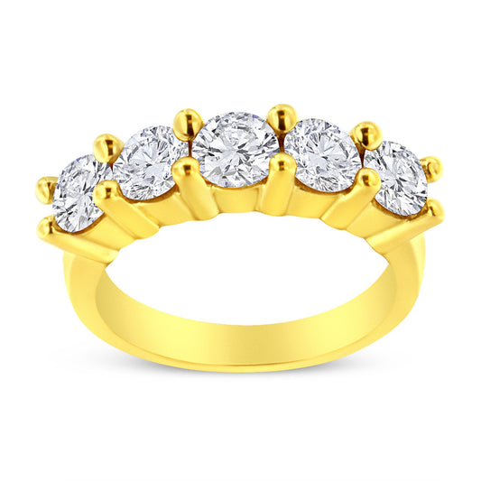 Front angled view of a yellow metal ring featuring five round white gemstones set in prongs.