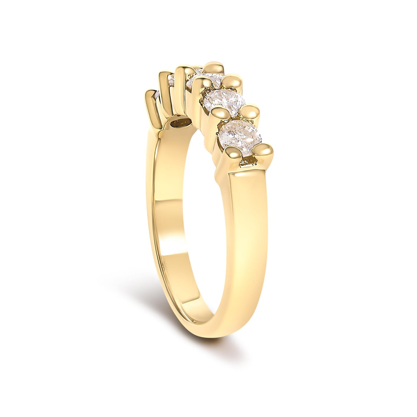 Yellow metal ring with five round white gemstones in prong setting, shown at a slight angle.