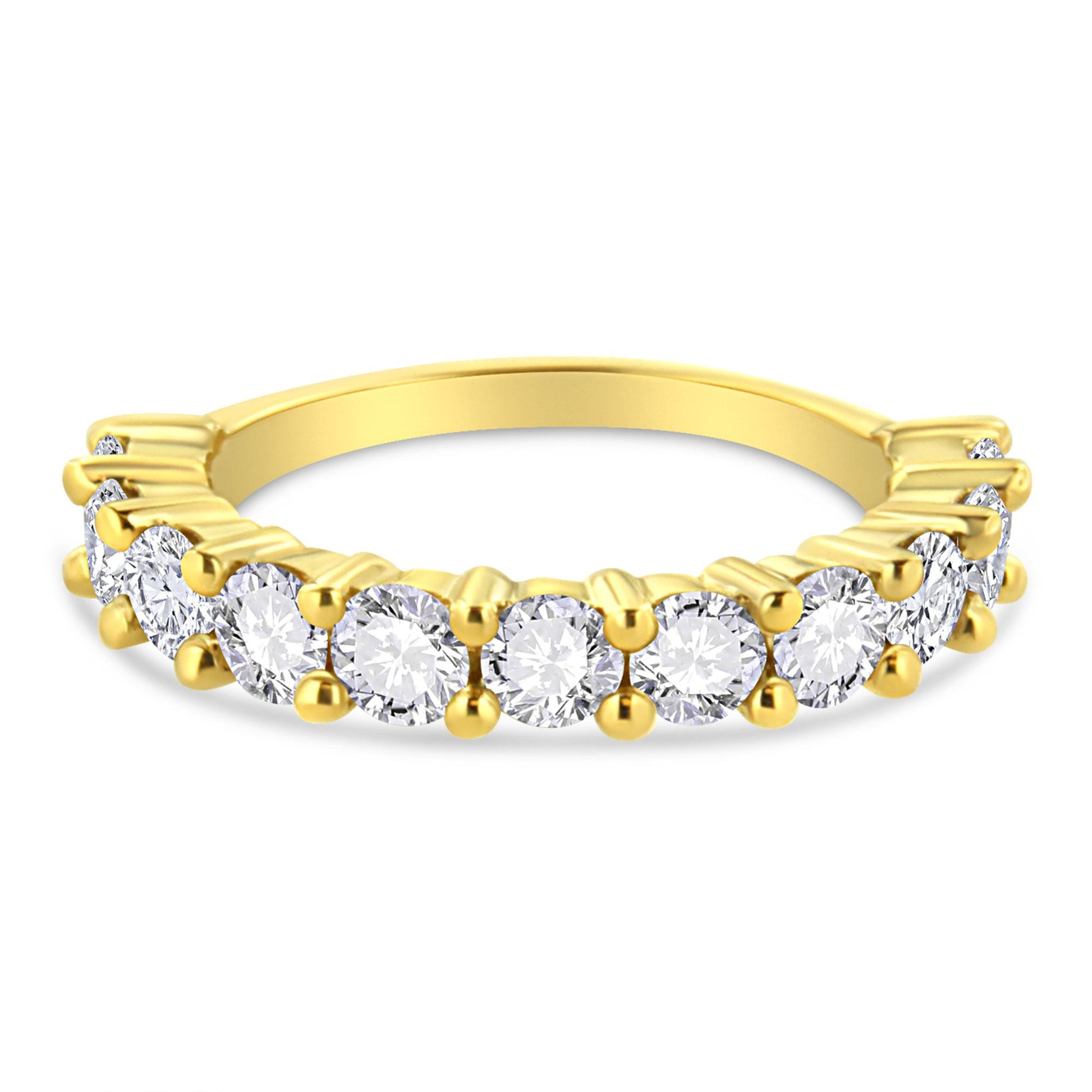 Yellow metal ring with round white gemstones in prong settings, front angle view.