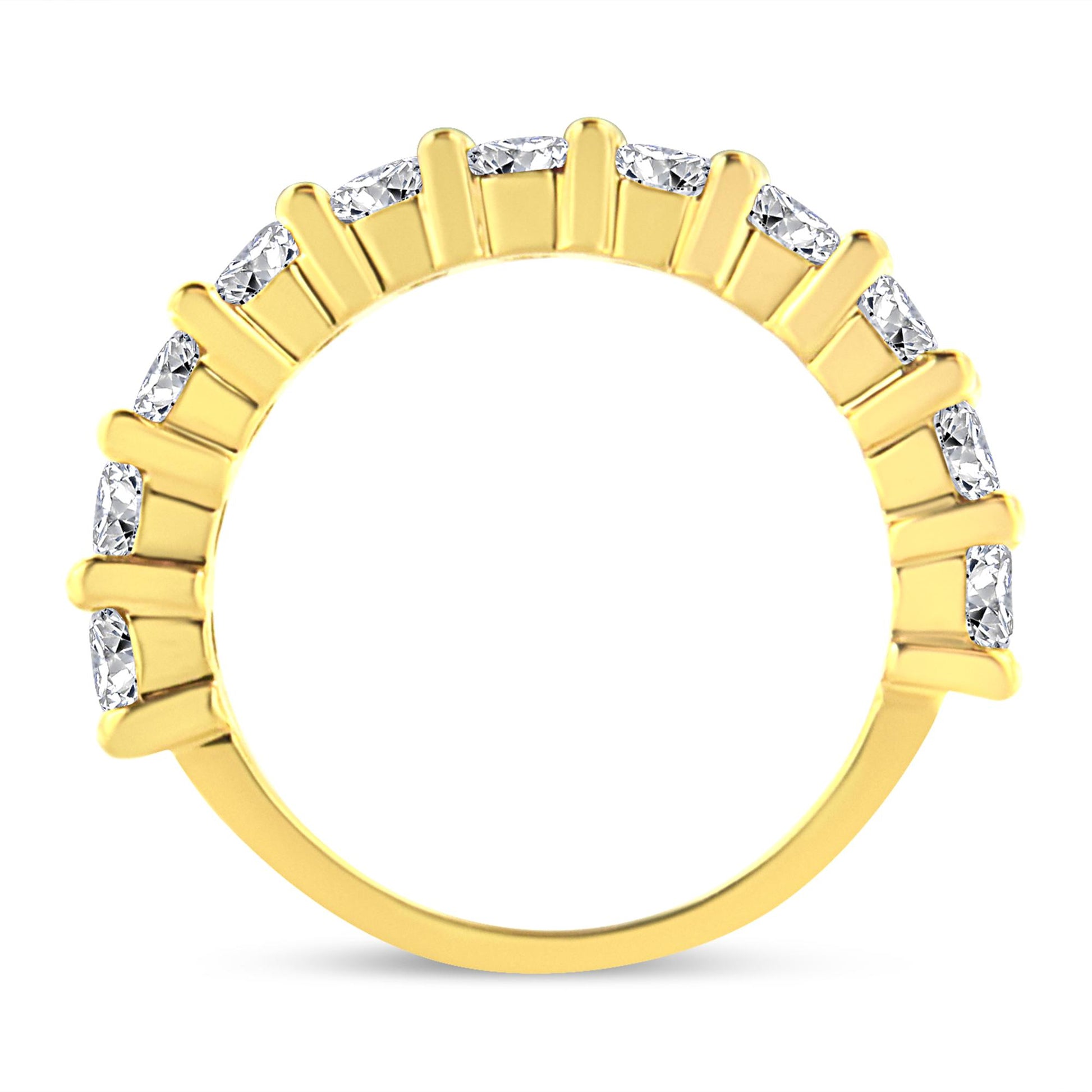 Front-facing shot of a yellow ring with round white gemstones set in prongs along the top half of the band.