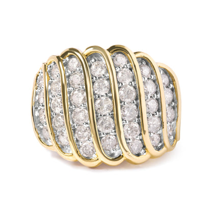 Yellow metal ring with multiple rows of white round gemstones in prong settings, shown in a close-up angle.