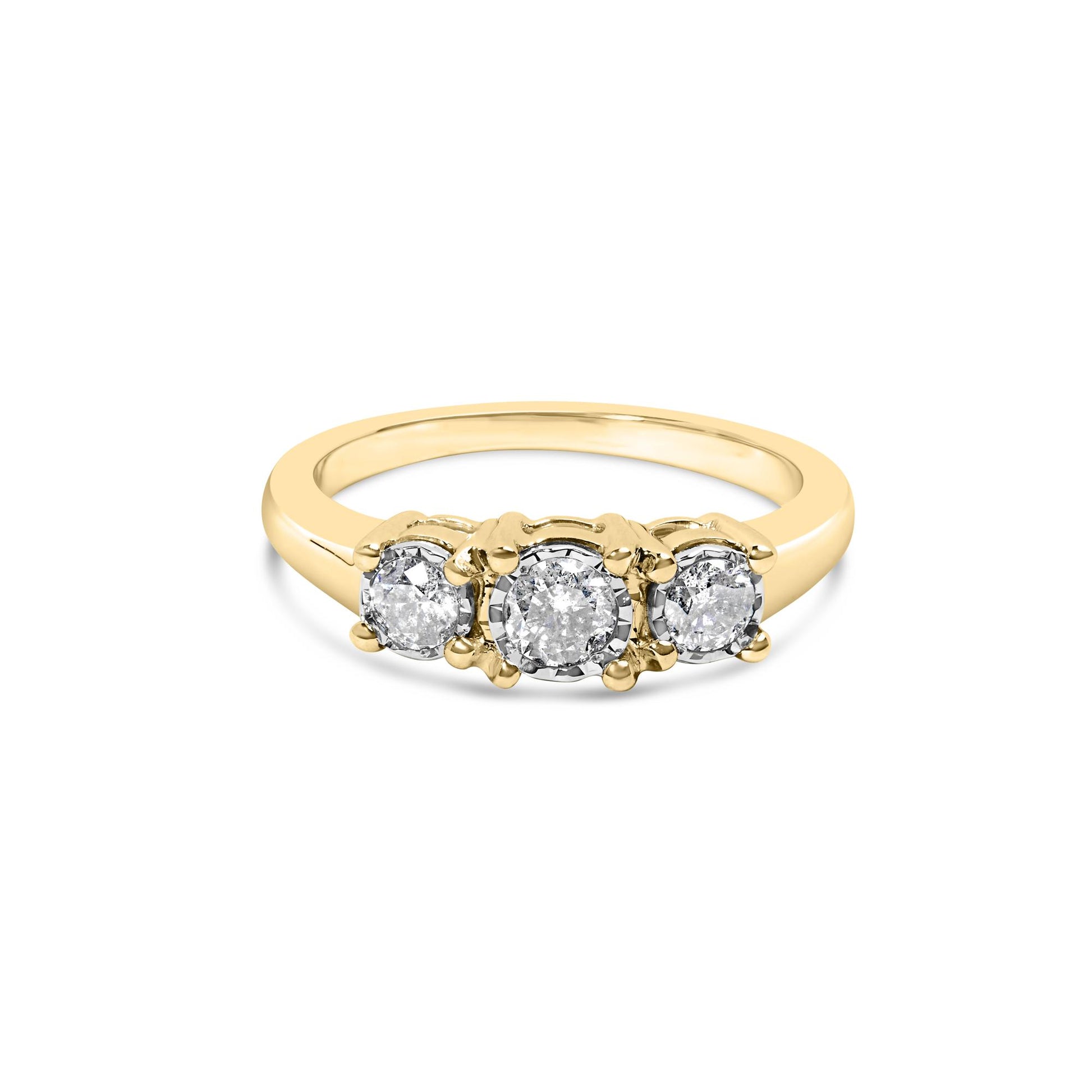Front angle view of a yellow metal ring featuring three round white gemstones in a miracle setting.