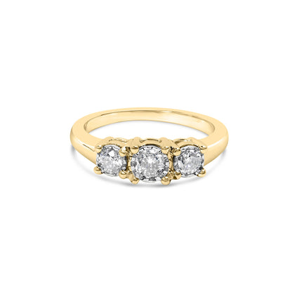 Front angle view of a yellow metal ring featuring three round white gemstones in a miracle setting.