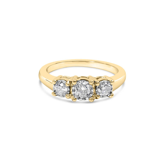 Front angle view of a yellow metal ring featuring three round white gemstones in a miracle setting.