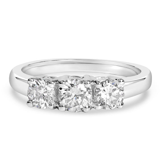 Front angle view of a white metal ring featuring three round white gemstones in 4-prong settings.