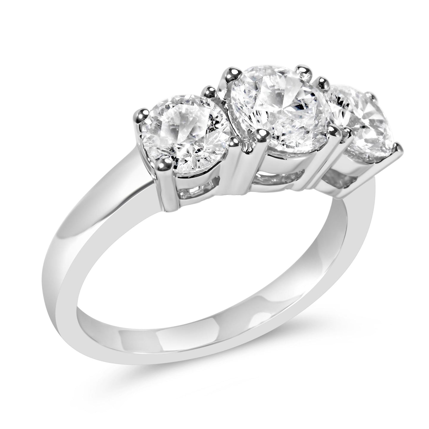 White metal ring with three round white gemstones in 4-prong settings, shown at an angled close-up.
