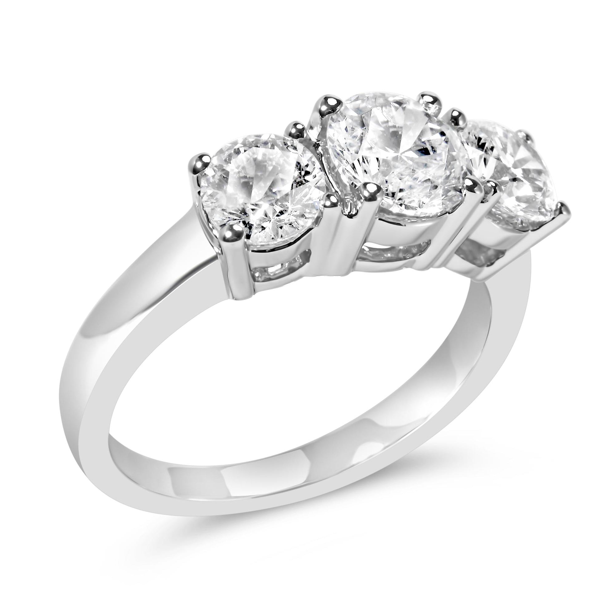 White metal ring with three round white gemstones in 4-prong settings, shown at an angled close-up.