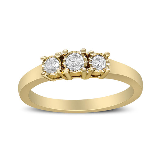 Yellow metal ring with three round white gemstones set in miracle settings, shown from a front angle.