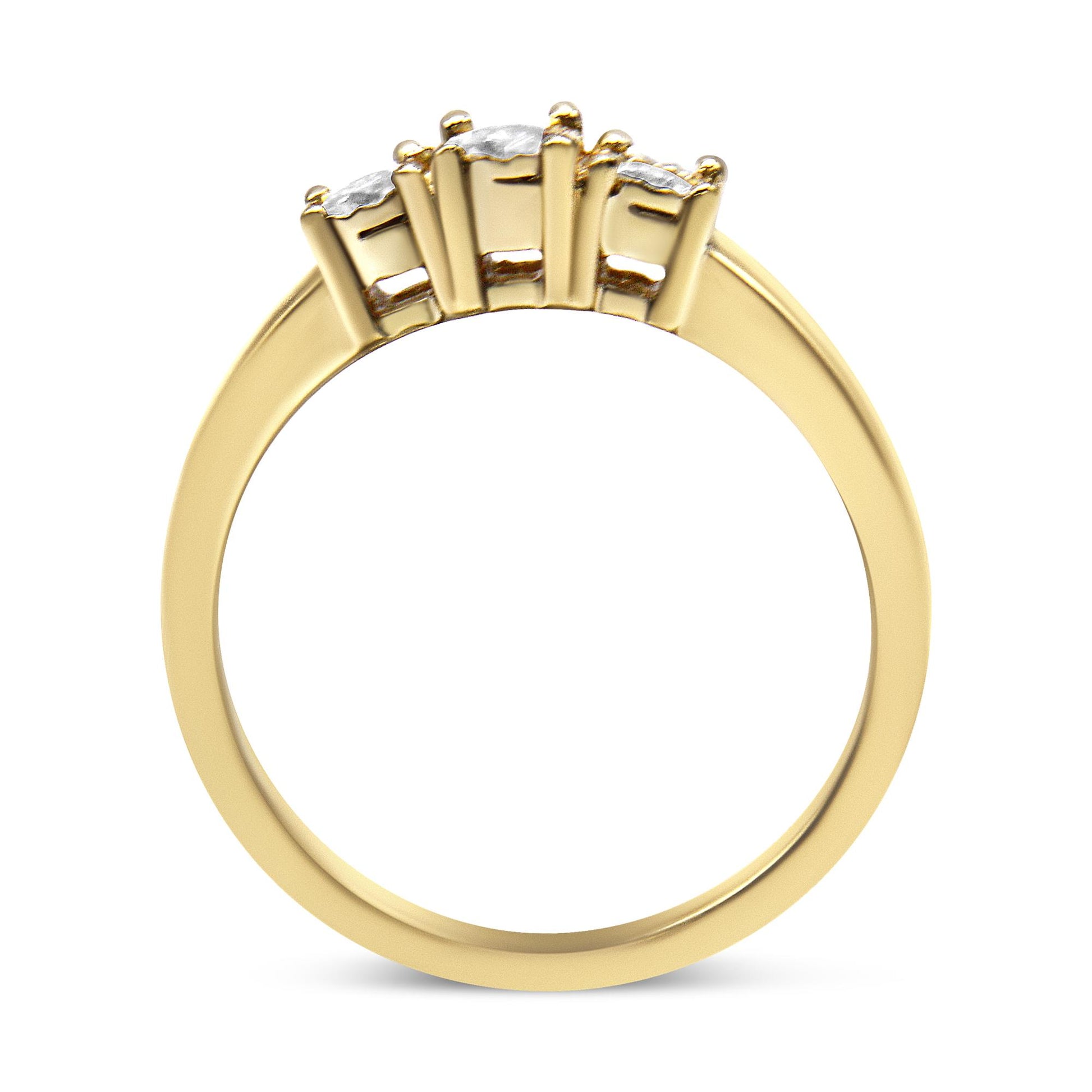 Yellow metal ring with three round white gemstones in a miracle setting, shown from a side angle.