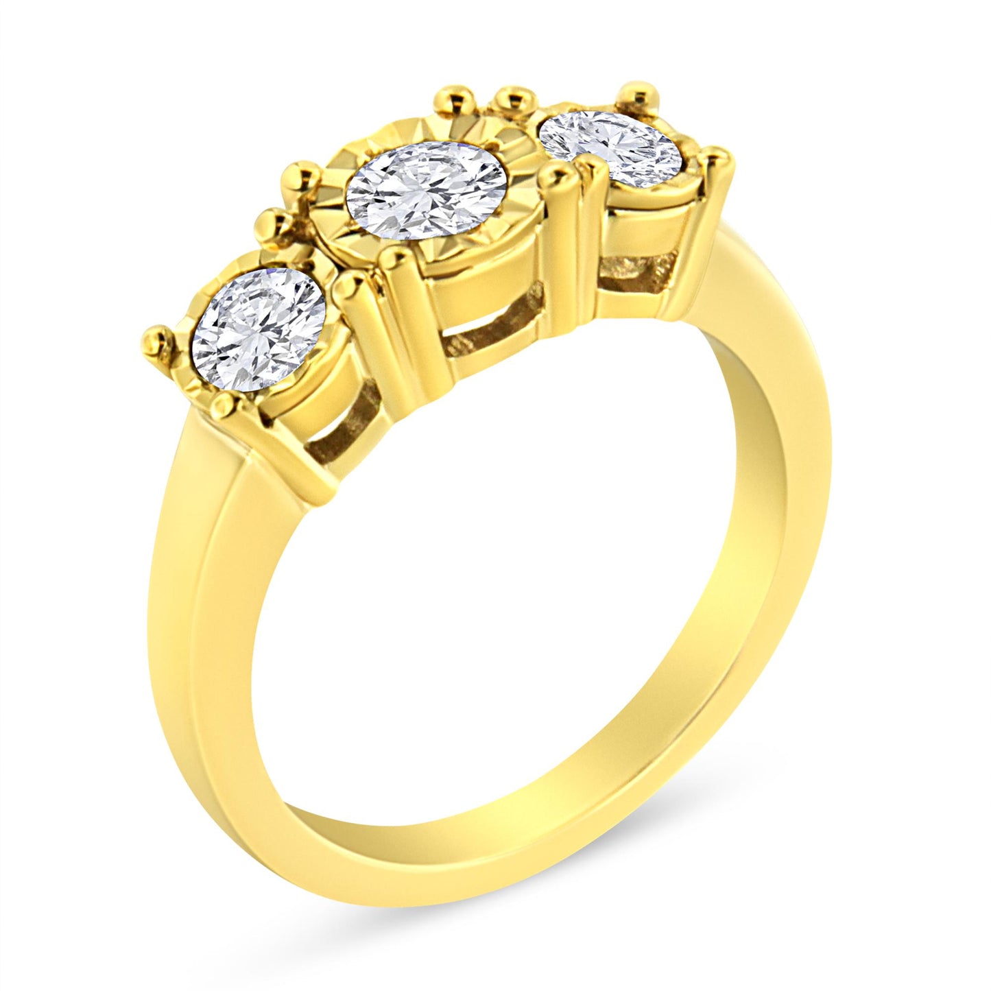 Yellow metal ring with three round white gemstones in a miracle setting, angled top view.