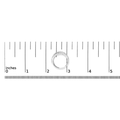 White metal ring with multiple overlapping bands encrusted with round white gemstones in prong settings, shown at front angle with size comparison on a ruler and coins.