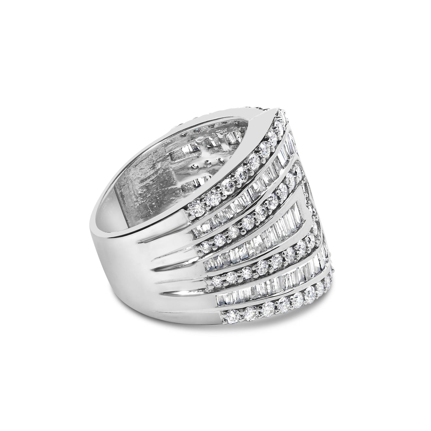 White metal ring with alternating rows of round prong-set white gemstones and baguette channel-set white gemstones, shown in a side angled view.