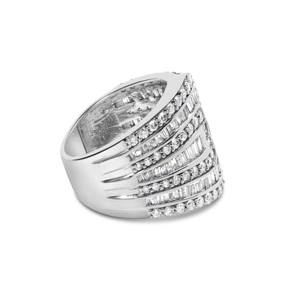 White metal ring with alternating rows of round prong-set white gemstones and baguette channel-set white gemstones, shown in a side angled view.