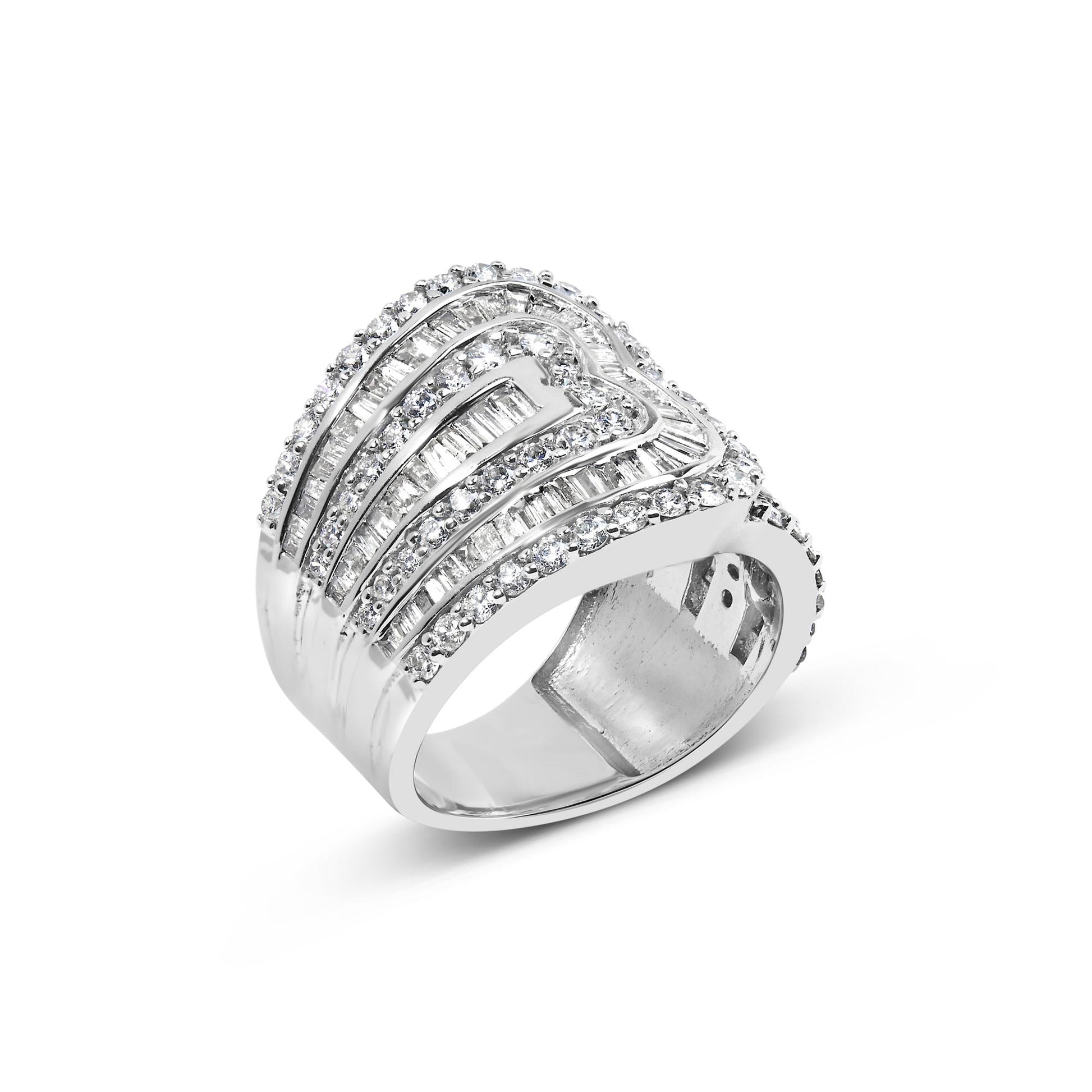 White metal ring set with multiple rows of round white gemstones in prong settings and baguette white gemstones in channel settings, shown at an angled front view.