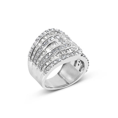 White metal ring set with multiple rows of round white gemstones in prong settings and baguette white gemstones in channel settings, shown at an angled front view.
