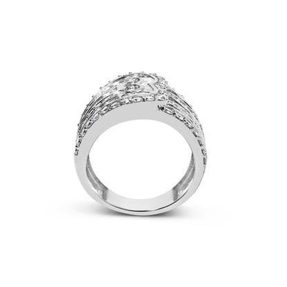 White metal ring with multiple rows of round and baguette white gemstones in prong and channel settings, shown from a front angle on a white background.