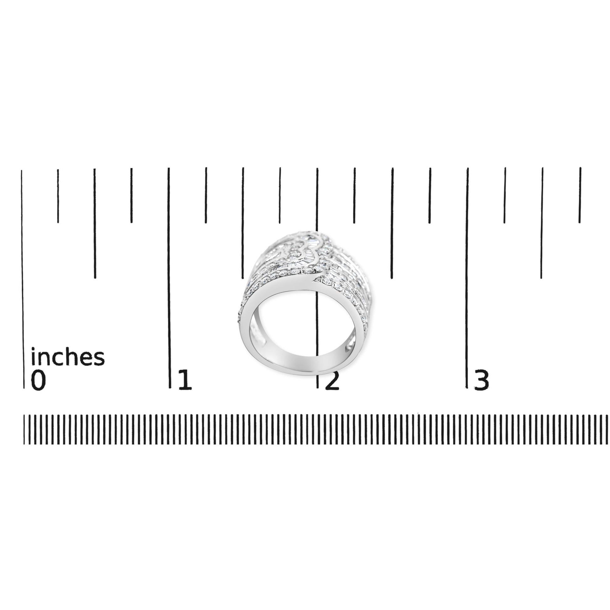 White metal ring with alternating rows of round prong-set white gemstones and baguette channel-set white gemstones, photographed from above on a ruler for size reference.