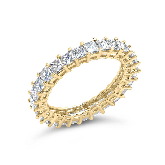 Yellow ring set with white princess cut gemstones in prong settings, shown at an angled close-up.