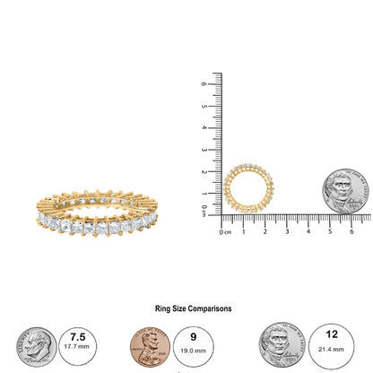 Top-down and side angle view of a yellow ring with princess shape white gemstones in a prong setting, shown next to a ruler and coins for size reference.