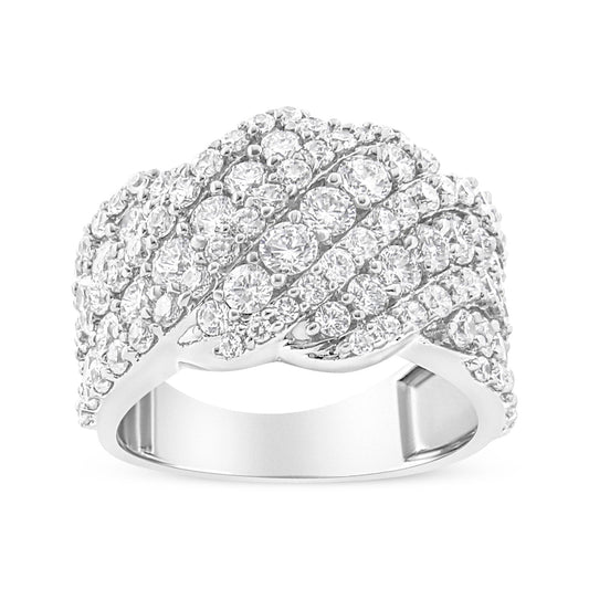White metal ring with multiple rows of round white gemstones in prong settings, shown from a front angle.