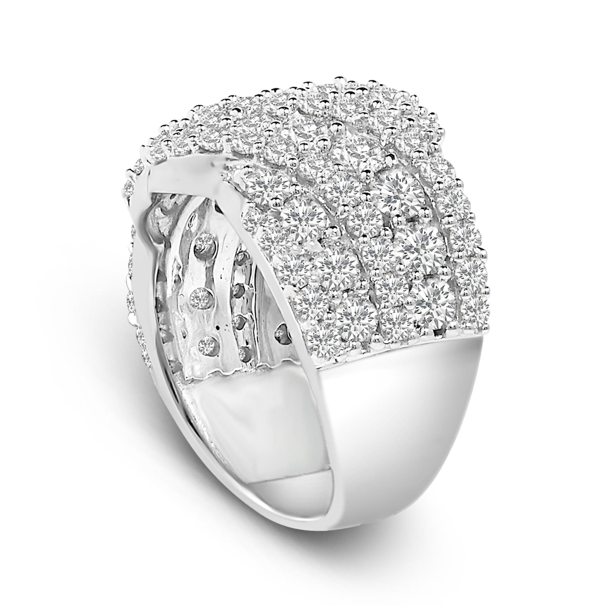 White metal ring covered with multiple round white gemstones in prong settings, shown in a close-up angled view.