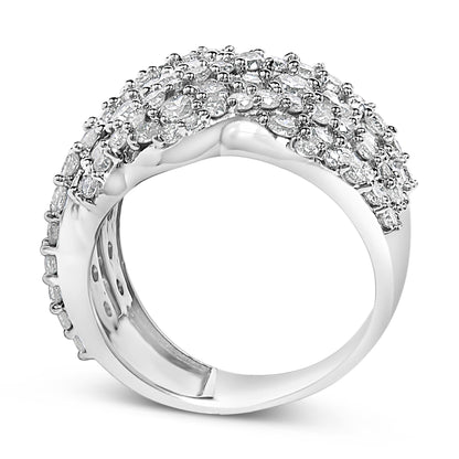 Close-up front side angle of a white metal ring with multiple rows of round white gemstones in prong settings covering the top half.