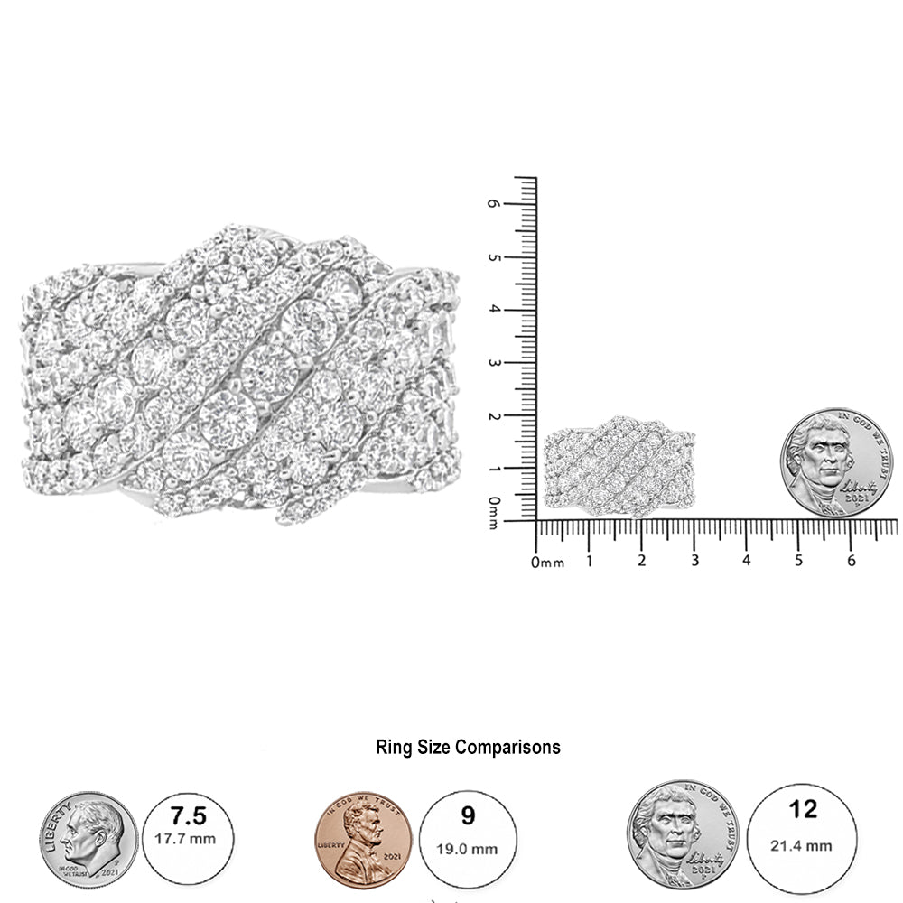 White metal ring with diagonal rows of prong-set round white gemstones, shown in close-up and from the front on a ruler and coin scale for size reference.