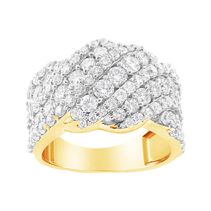 Yellow metal ring with multiple rows of round white gemstones in prong settings, shown in a front angle close-up.
