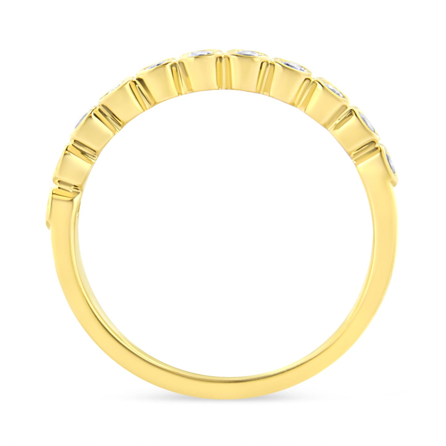 Yellow metal ring shown from the side with round brownish gemstones in prong settings along the top half.
