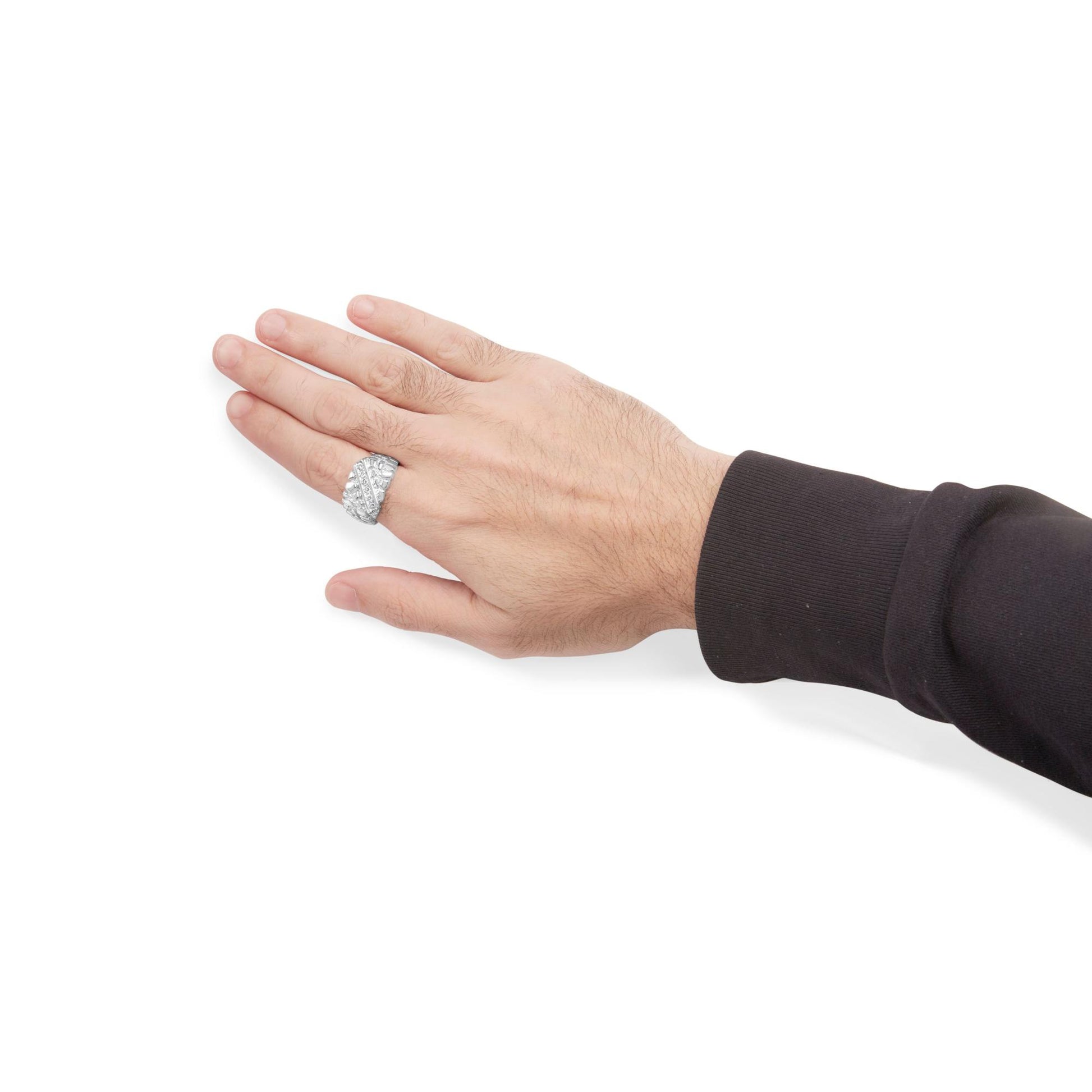 White metal ring with round white gemstones in channel setting, shown worn on a model's hand, side angle.