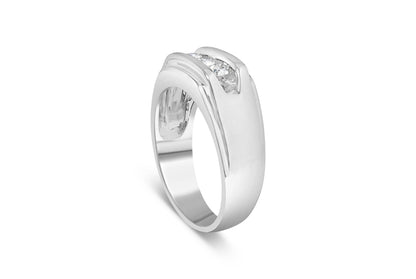 White metal ring with three round white gemstones set in a channel, side angle view.