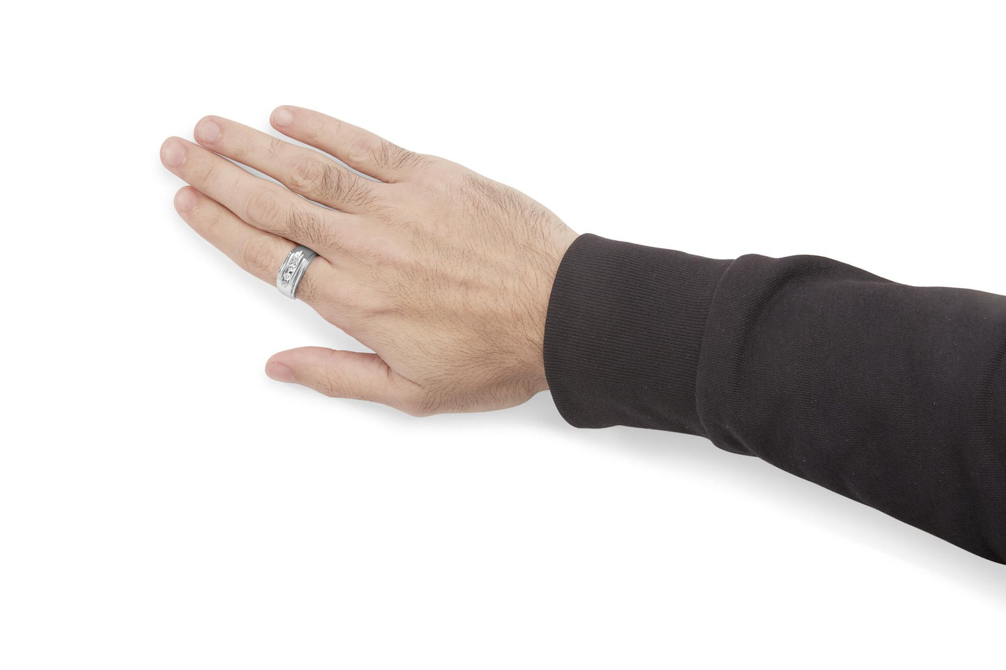 White-colored ring with three round white gemstones set in a channel, shown on a hand at a side angle.