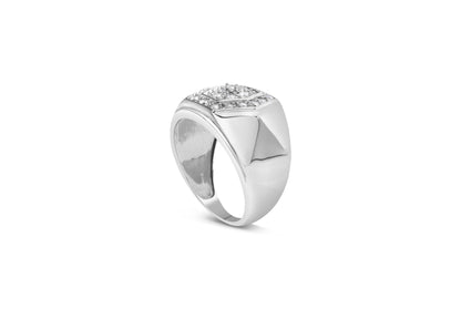 White metal ring with a square top set with one larger and multiple smaller round white gemstones in prong settings, shown at a slight angle.