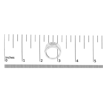 White metal ring with a cluster of round white gemstones set on top, shown from a top-down angle, placed on a ruler for size reference.