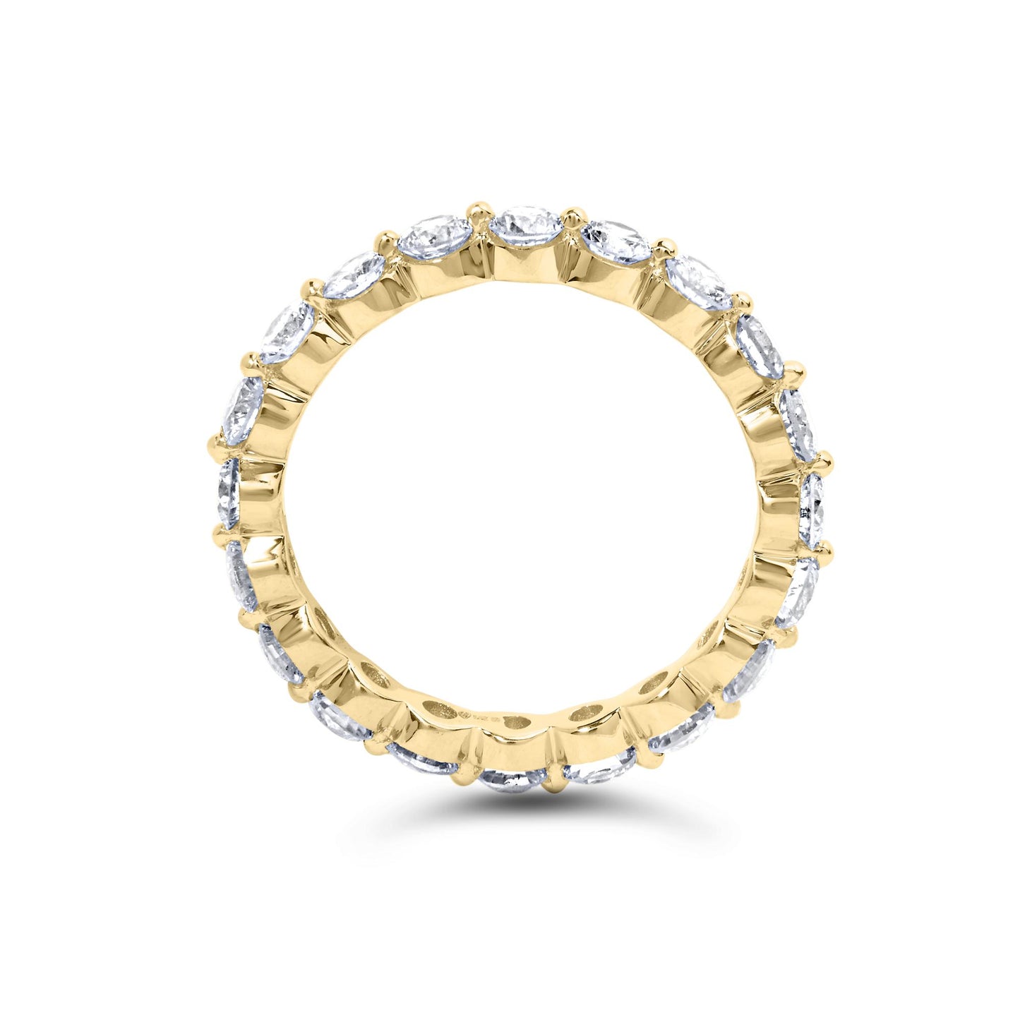 Yellow metal ring with round white gemstones in prong settings encircling the band, shown from a front angle.