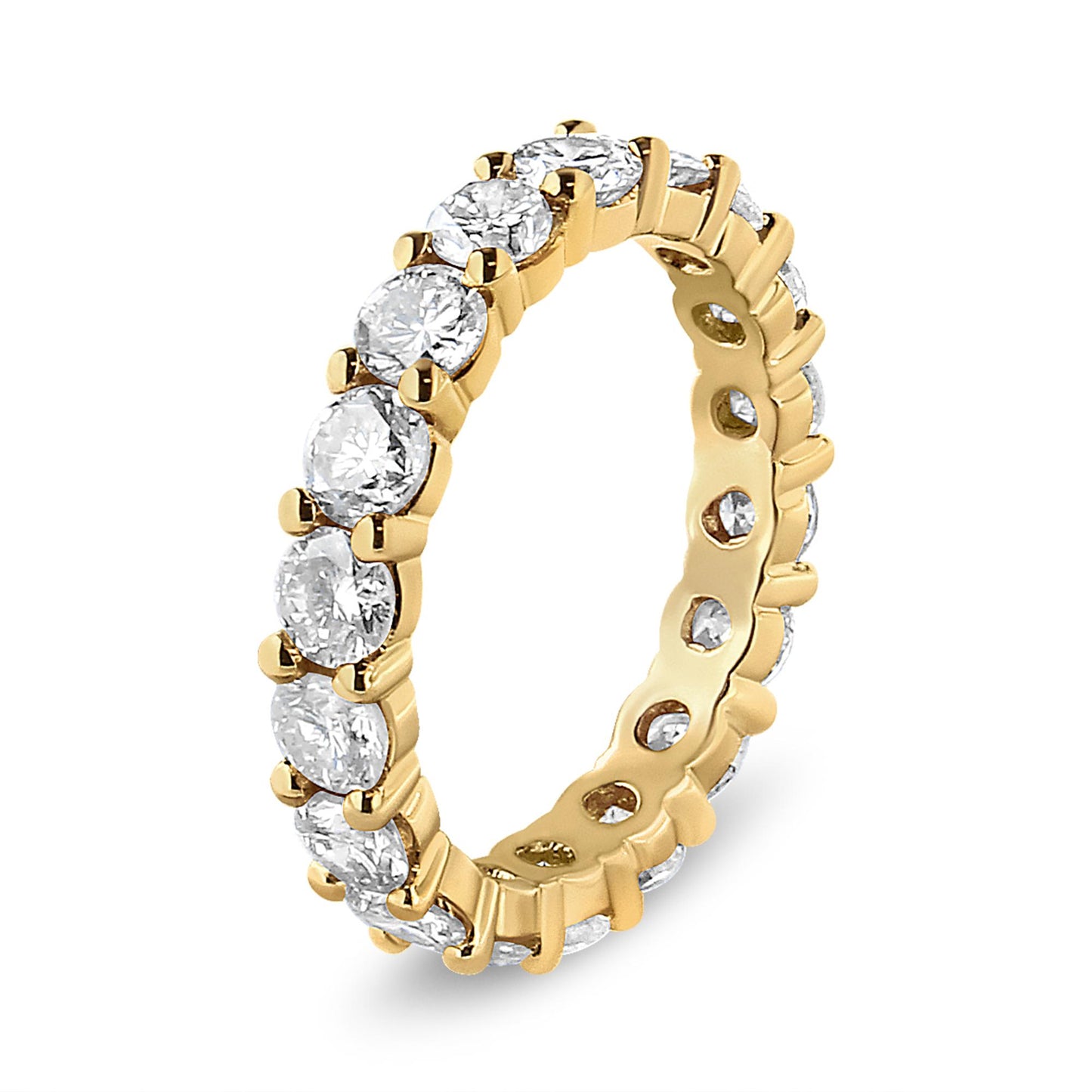 Ring with yellow metal band featuring round white gemstones in prong settings all around, shown at an angled view.