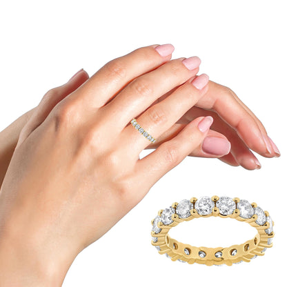 Yellow metal ring with round white gemstones in prong setting, shown on a model’s hand and also a close-up angled side view of the ring.
