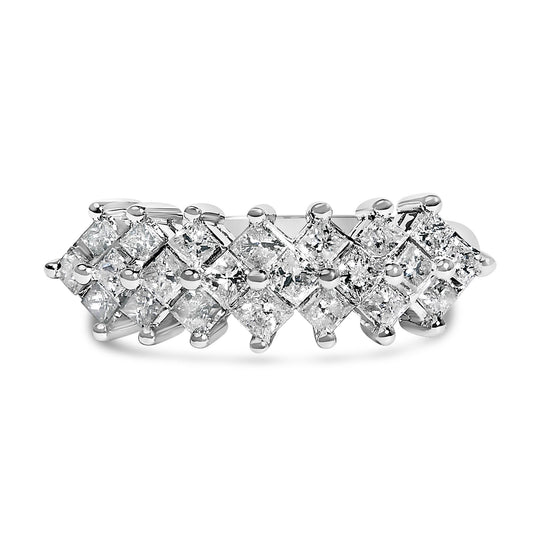 Close-up angled top view of a white ring featuring princess-shaped white gemstones set invisibly in two rows.