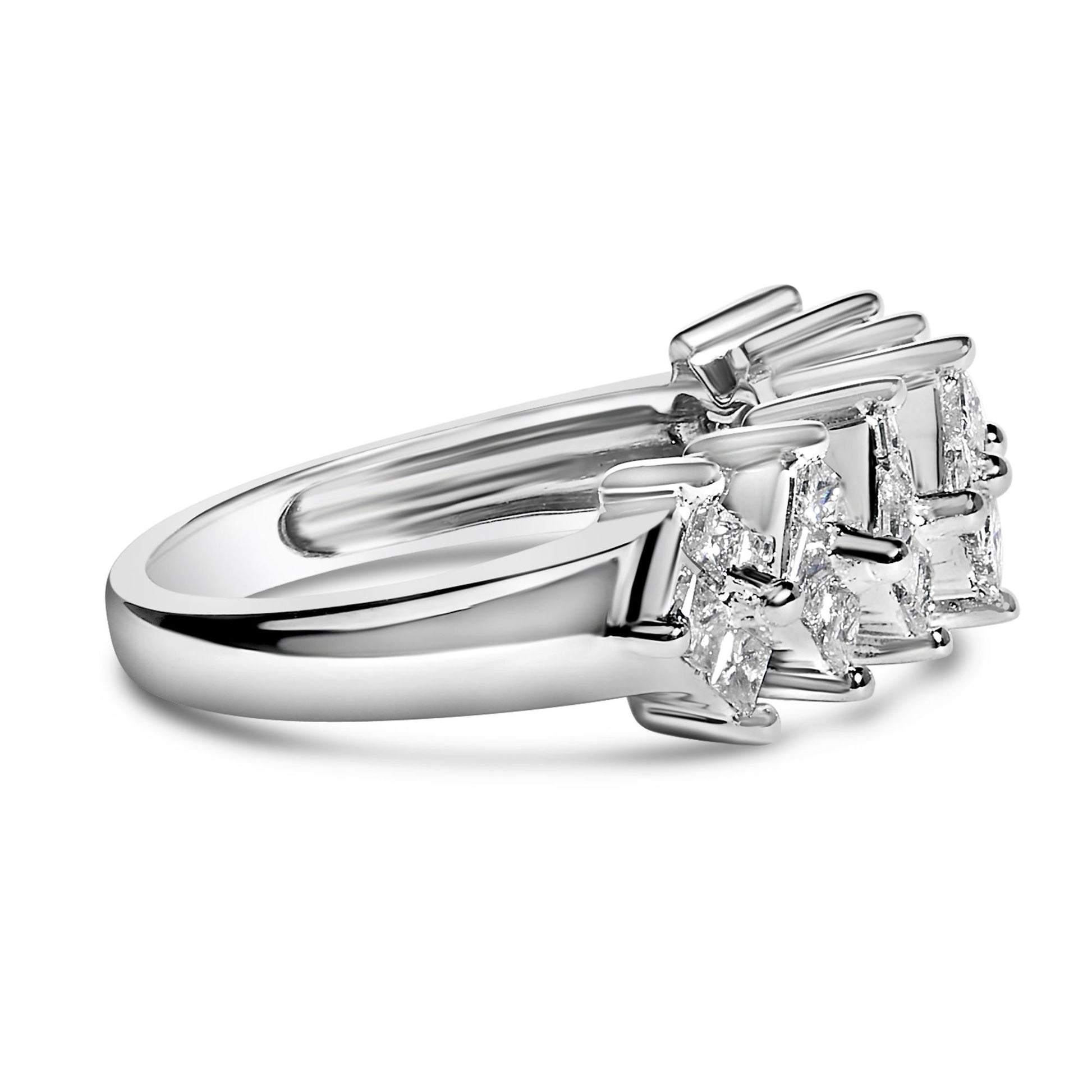 Close-up angled view of a white metal ring featuring princess-shaped white gemstones set invisibly in two clusters.