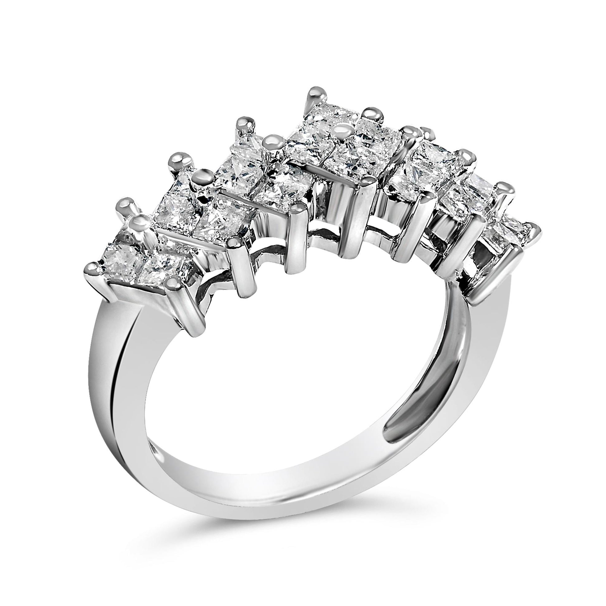 Close-up angled view of a white ring featuring rows of princess-shaped white gemstones with invisible settings, arranged in two layers along the top half of the band.
