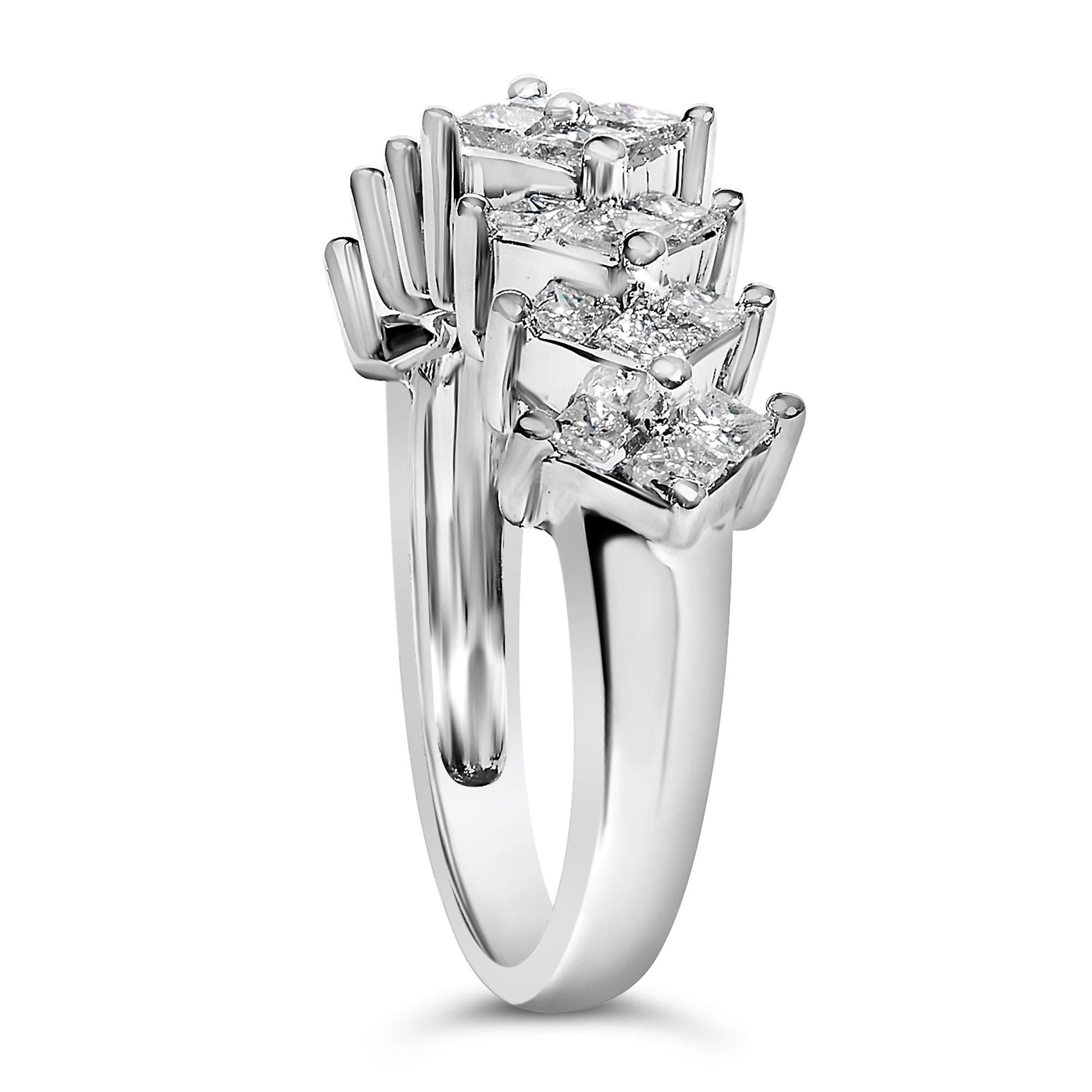Close-up front angled view of a white metal ring featuring clusters of princess-shaped white gemstones in invisible settings.