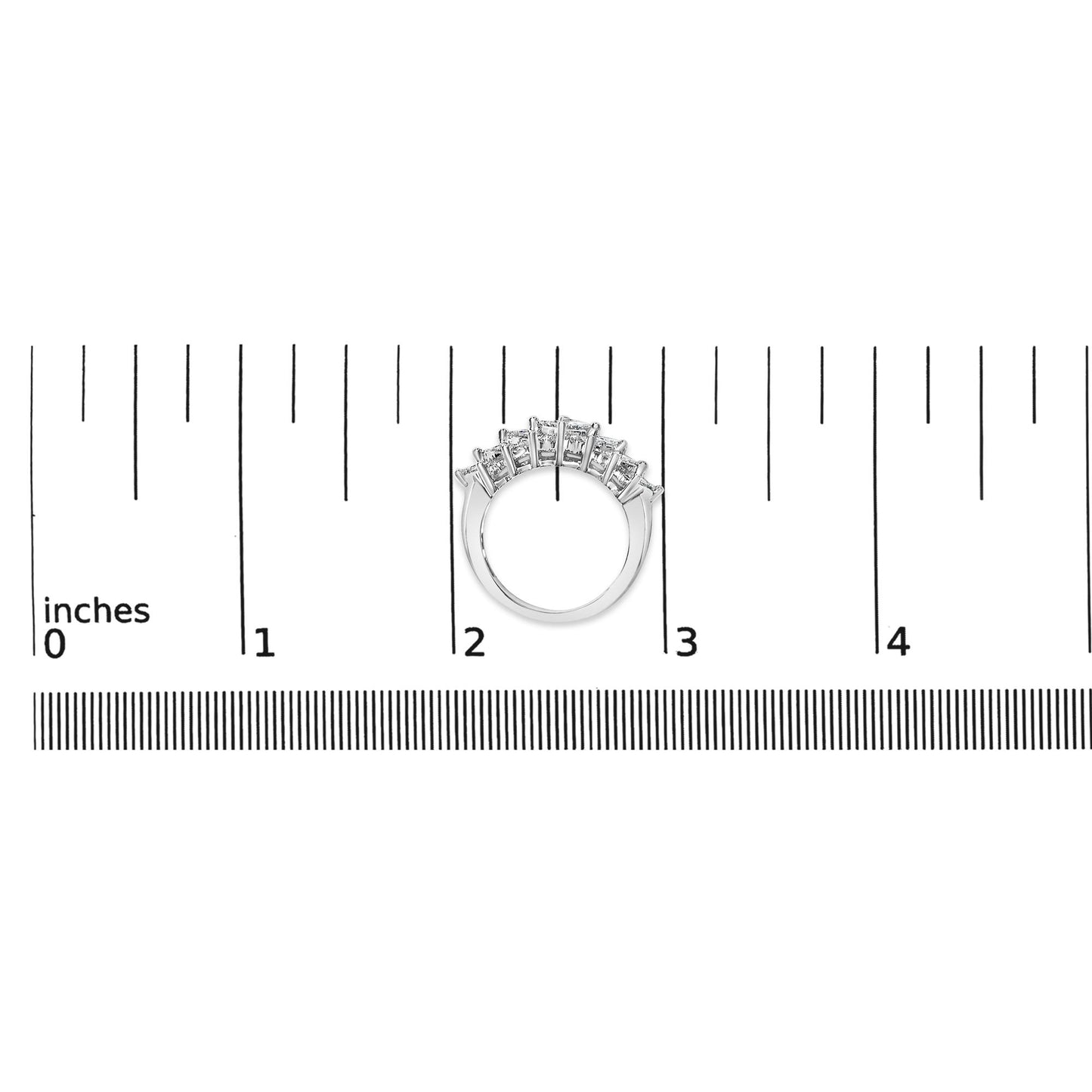 White metal ring shown on a scale, front angle, featuring two rows of white princess shape gemstones with invisible settings.