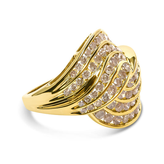 Yellow metal ring with multiple rows of round brownish gemstones in channel settings, shown in a front angled view.