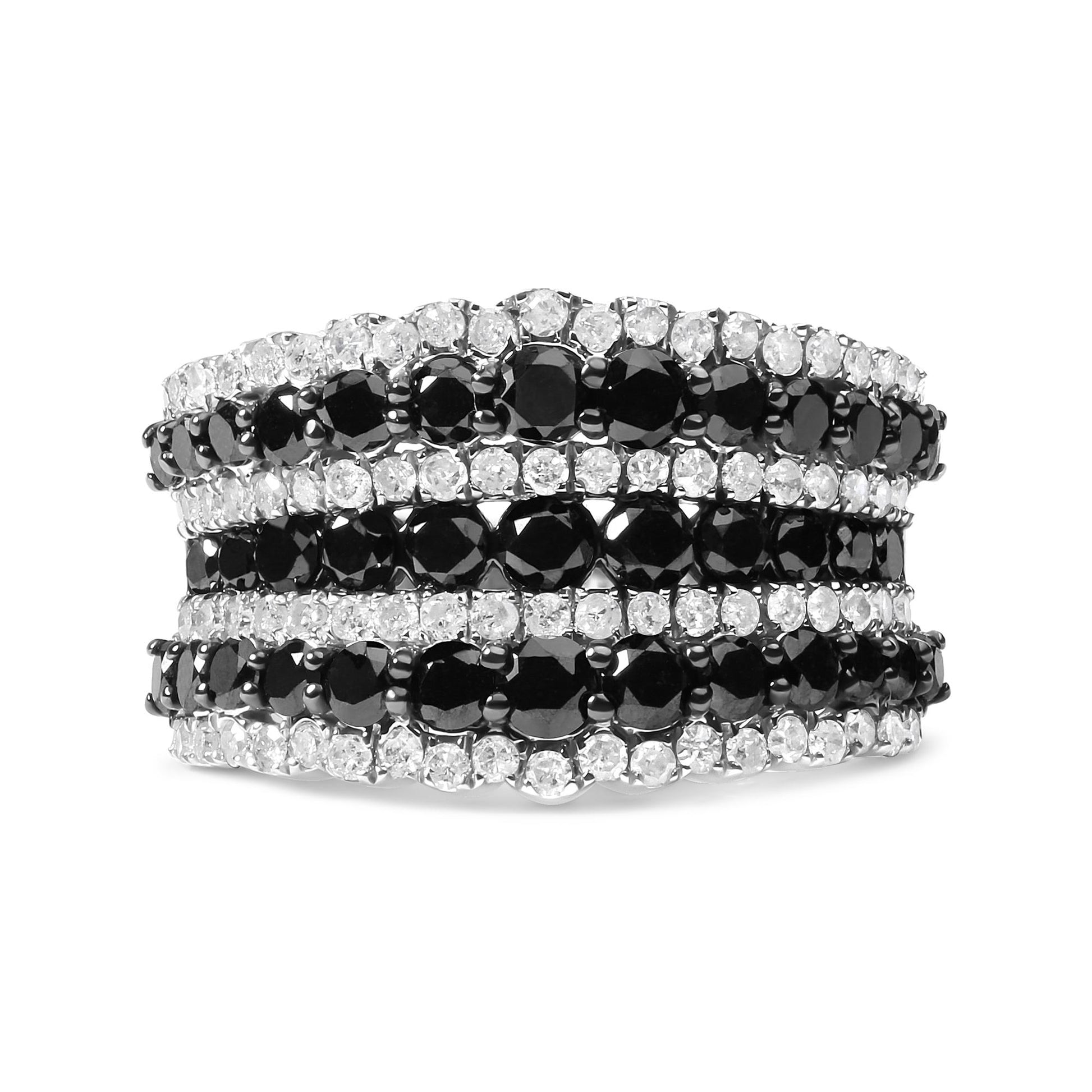 Close-up front angle of a white metal ring featuring alternating rows of round black and white gemstones in prong settings.