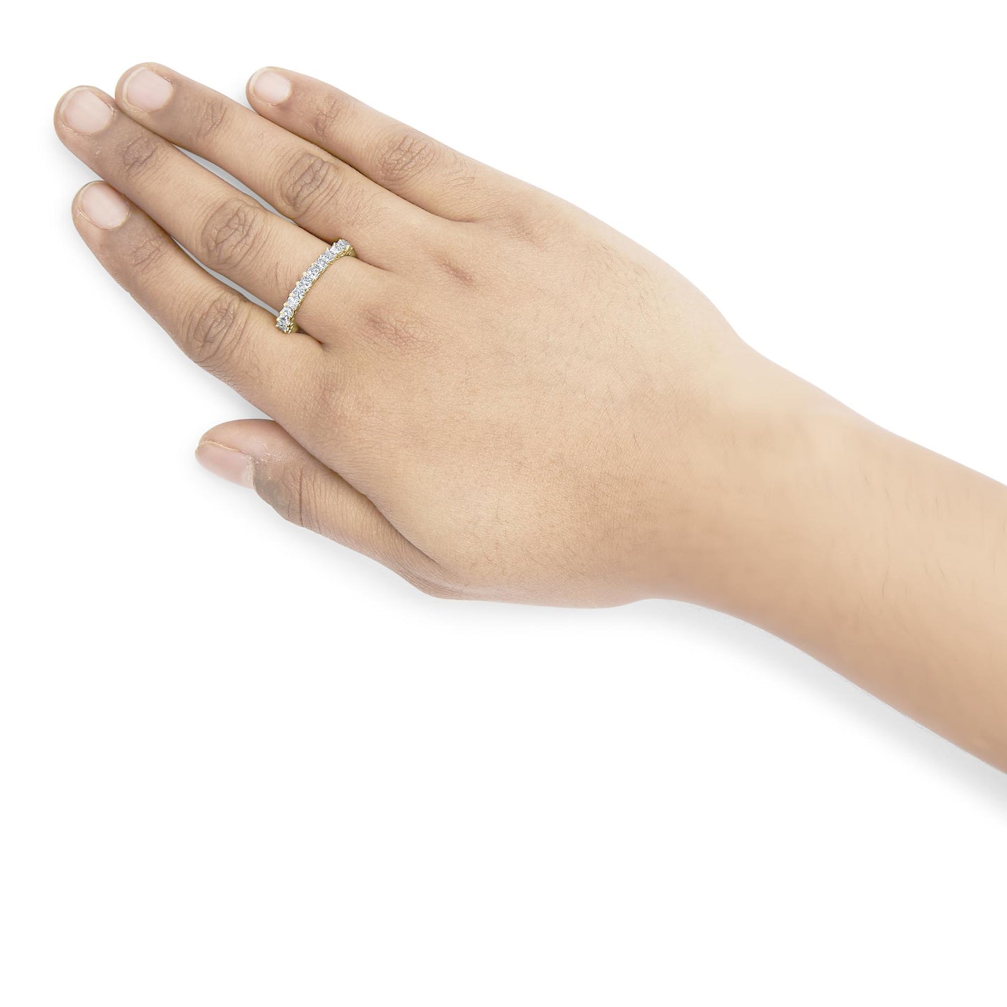 Yellow metal ring with white princess shape gemstones in shared prong setting, worn on a model's hand, angled from above.