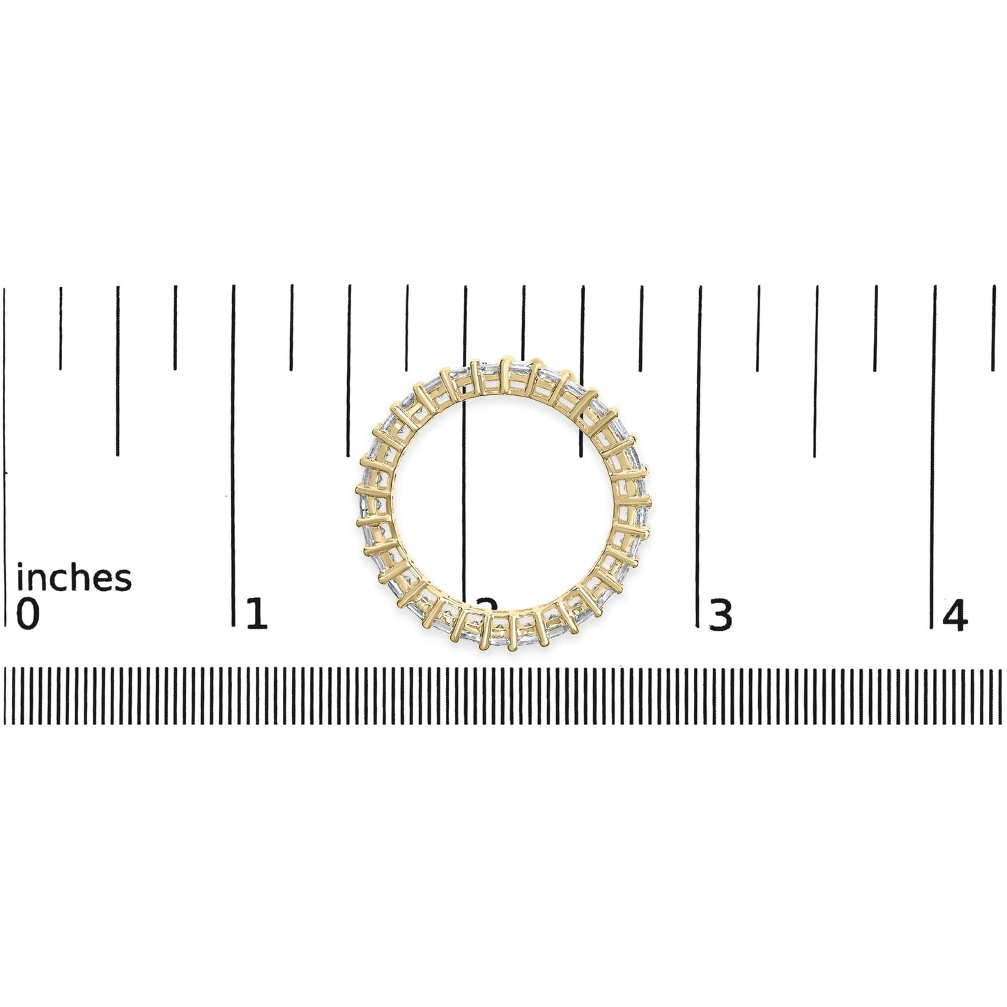 Top-down view of a yellow metal ring with white princess-shaped gemstones in a shared prong setting, placed on a ruler for size reference.