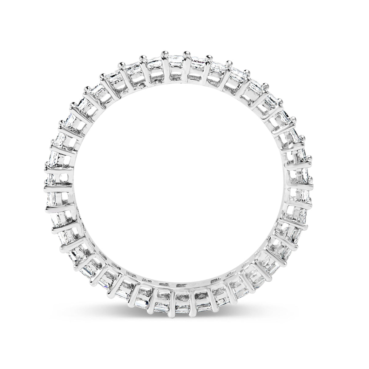 Close-up front view of a white ring featuring princess-shaped white gemstones in prong settings encircling the band, shown on a white background.